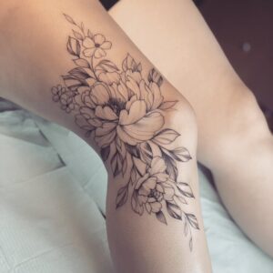 Flower tattoo on a woman's knee